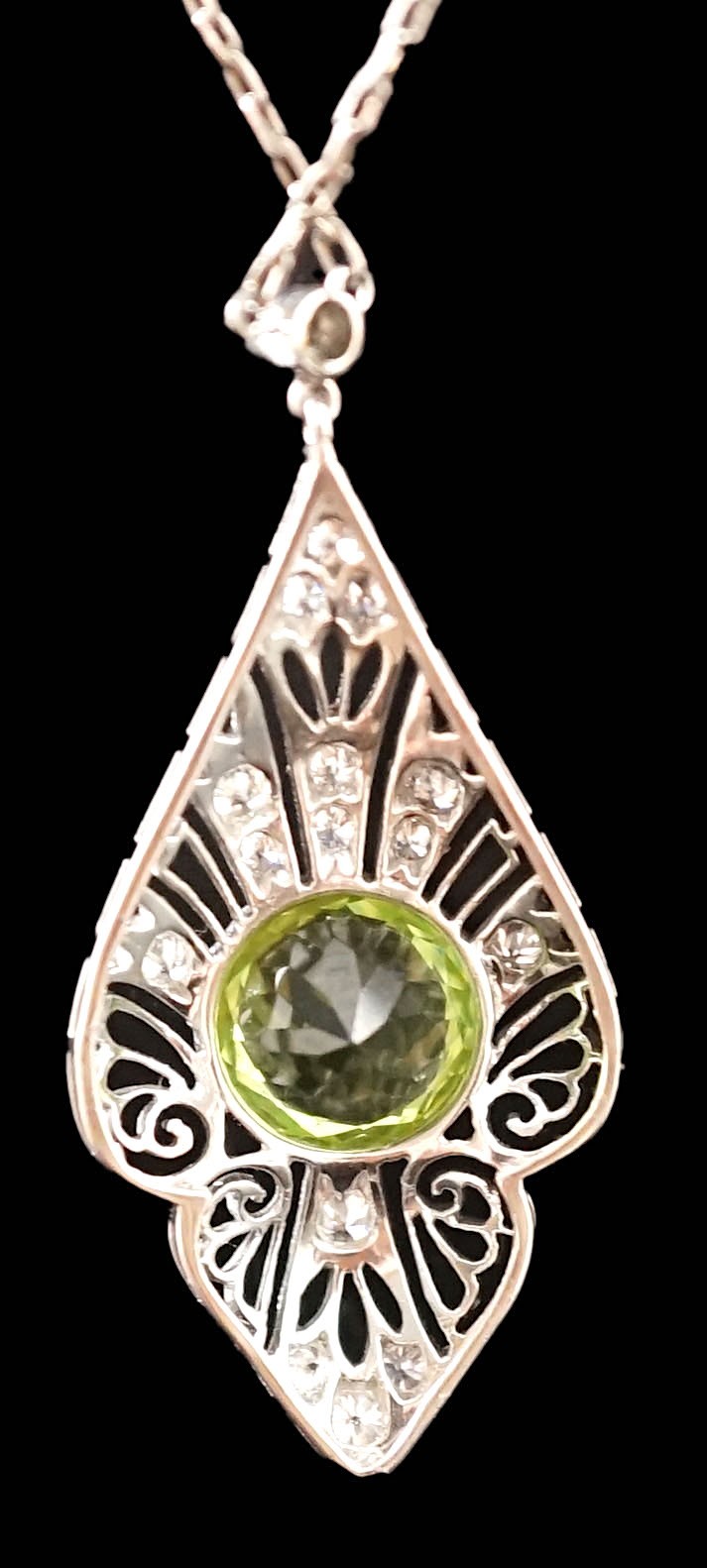 A 1920's pierced platinum, peridot and millegrain set diamond cluster set pendant necklace